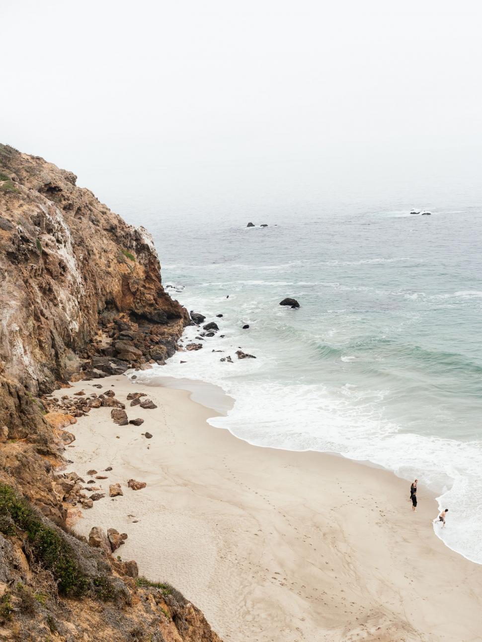 Free Image of Seaside cliff panorama with a couple 