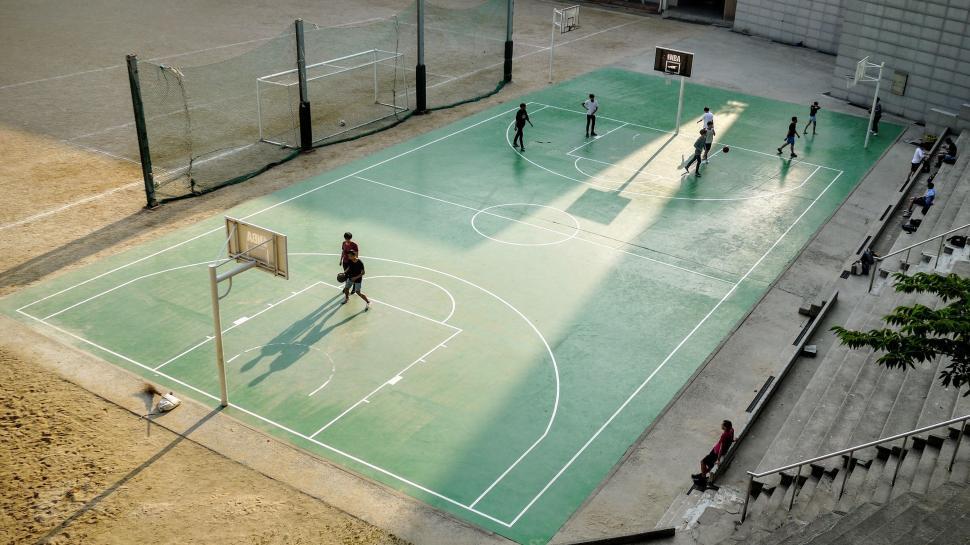 Free Image of Aerial view of basketball court with players 