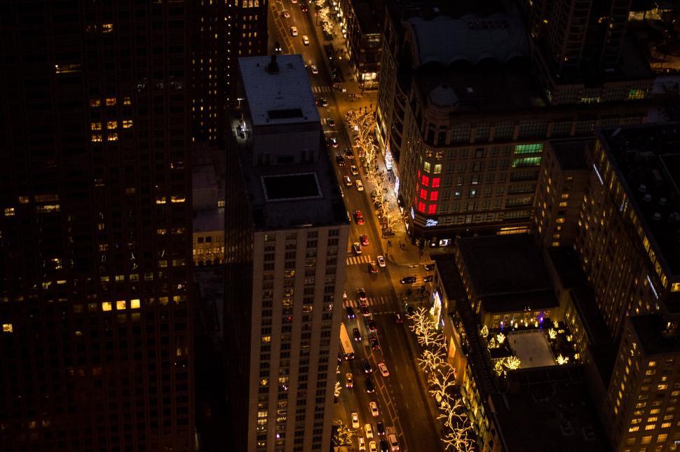 Free Image of Aerial view of city street lights at night 