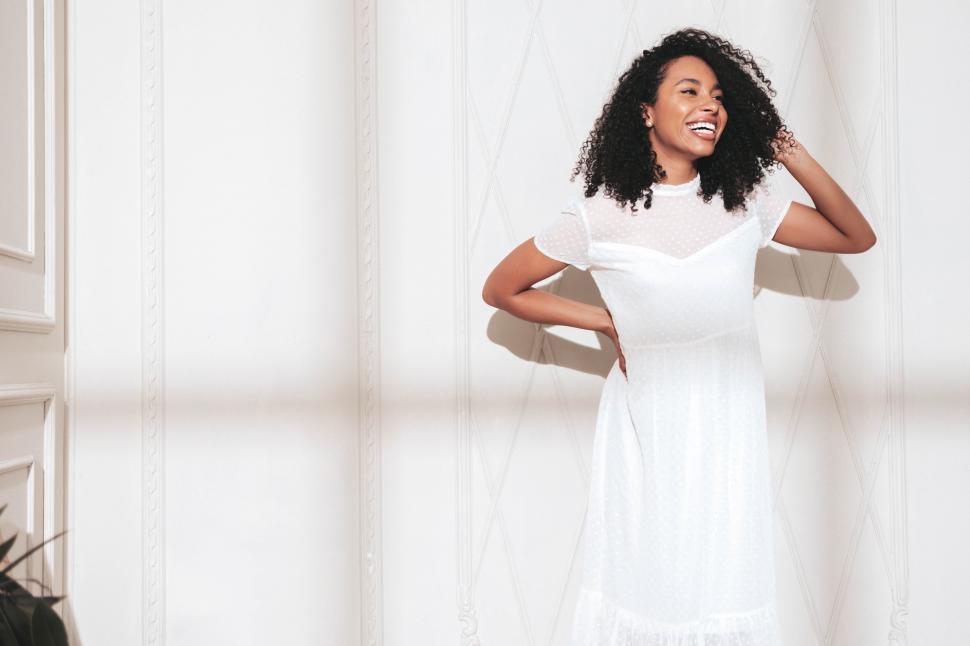 Free Image of A woman in a white dress 