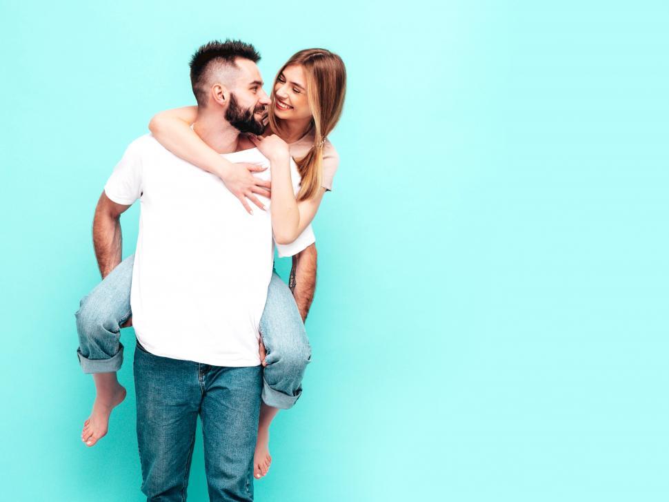Free Image of A man carrying a woman on his back 
