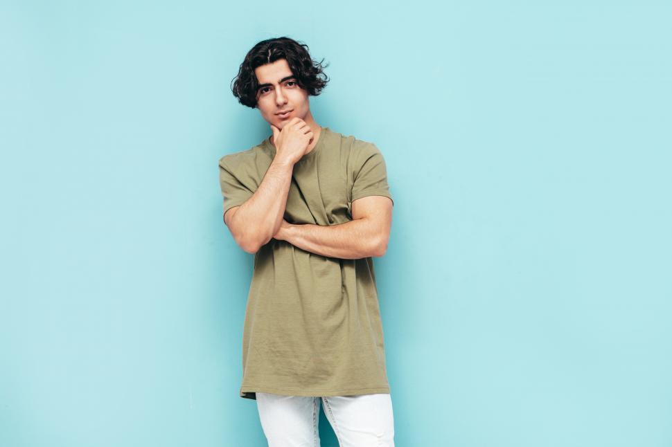 Free Image of A man with his hand on his chin 