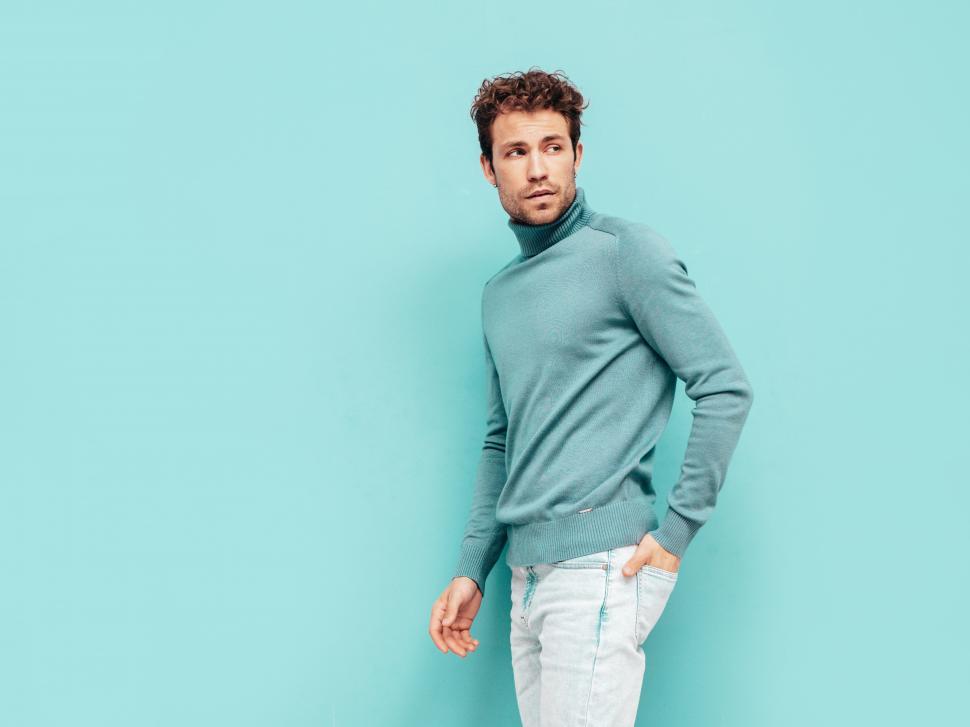 Free Image of A man in a blue sweater 