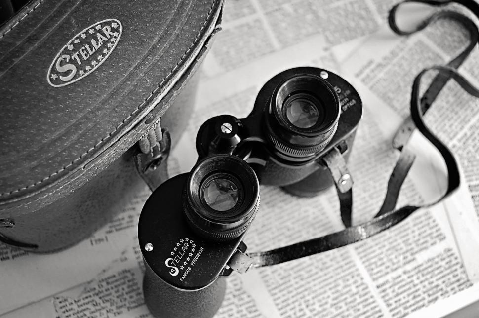 Free Image of Vintage camera and case on a newspaper 