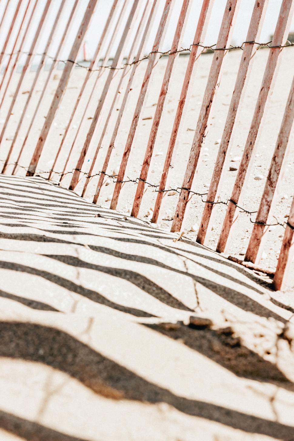 Free Image of Angular shadows form patterns on a textured wall 