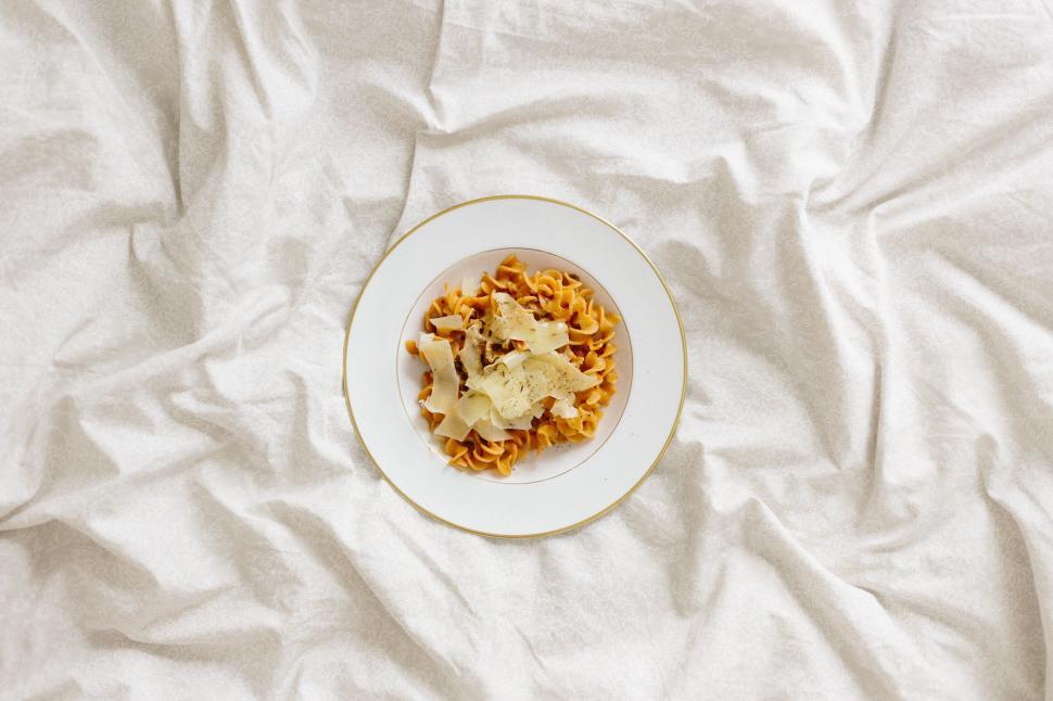 Free Image of Pasta dish elegantly presented on a plate 