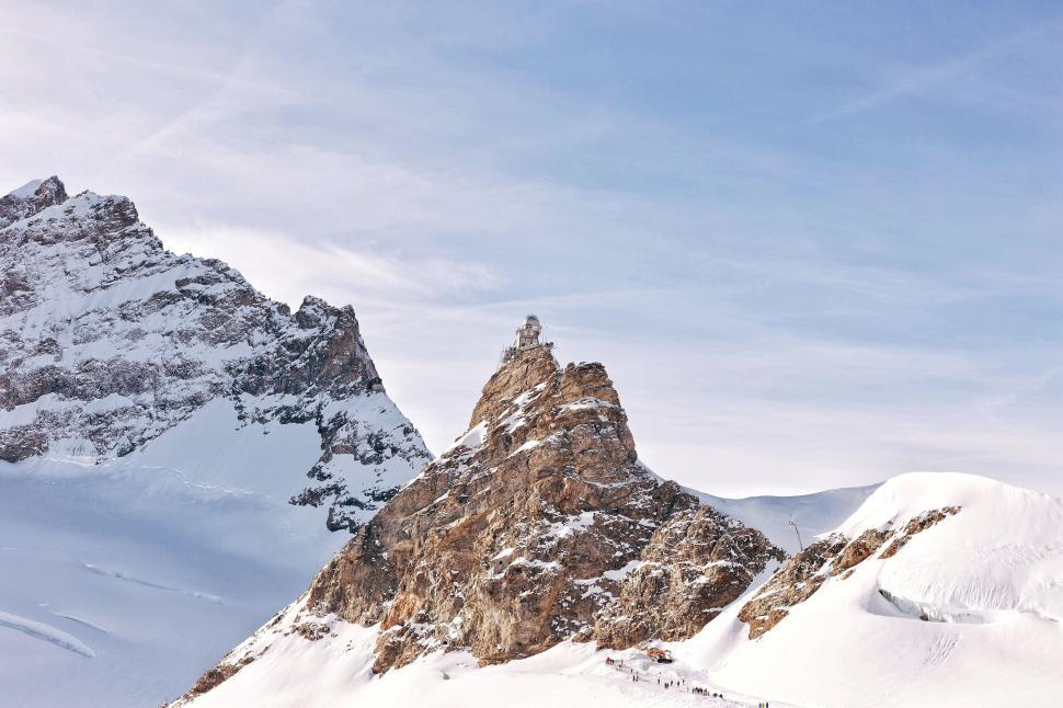 Free Image of Majestic mountain peak dusted with snow 