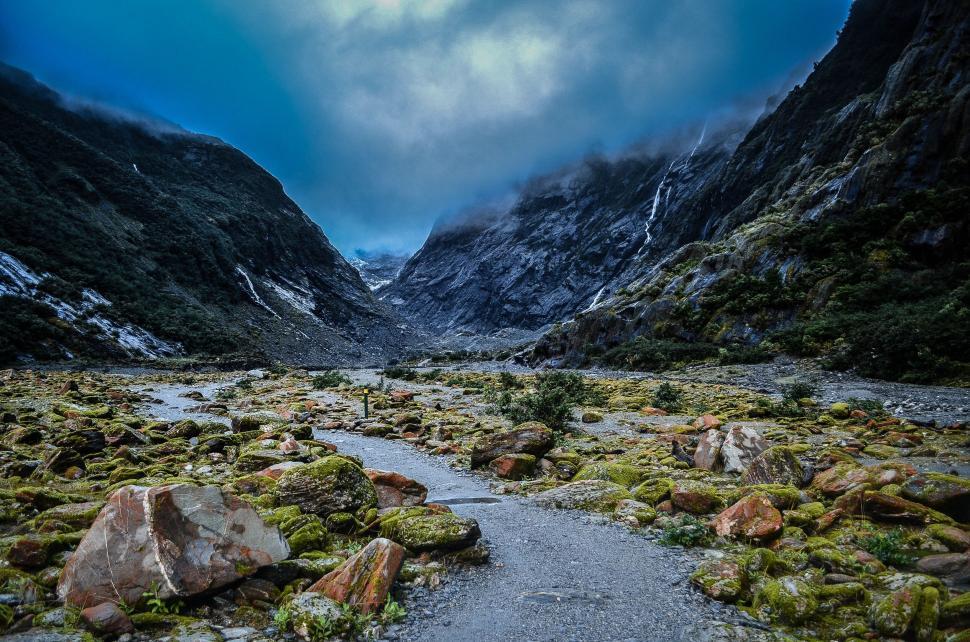 Free Image of Vibrant mountain valley with rocky path 