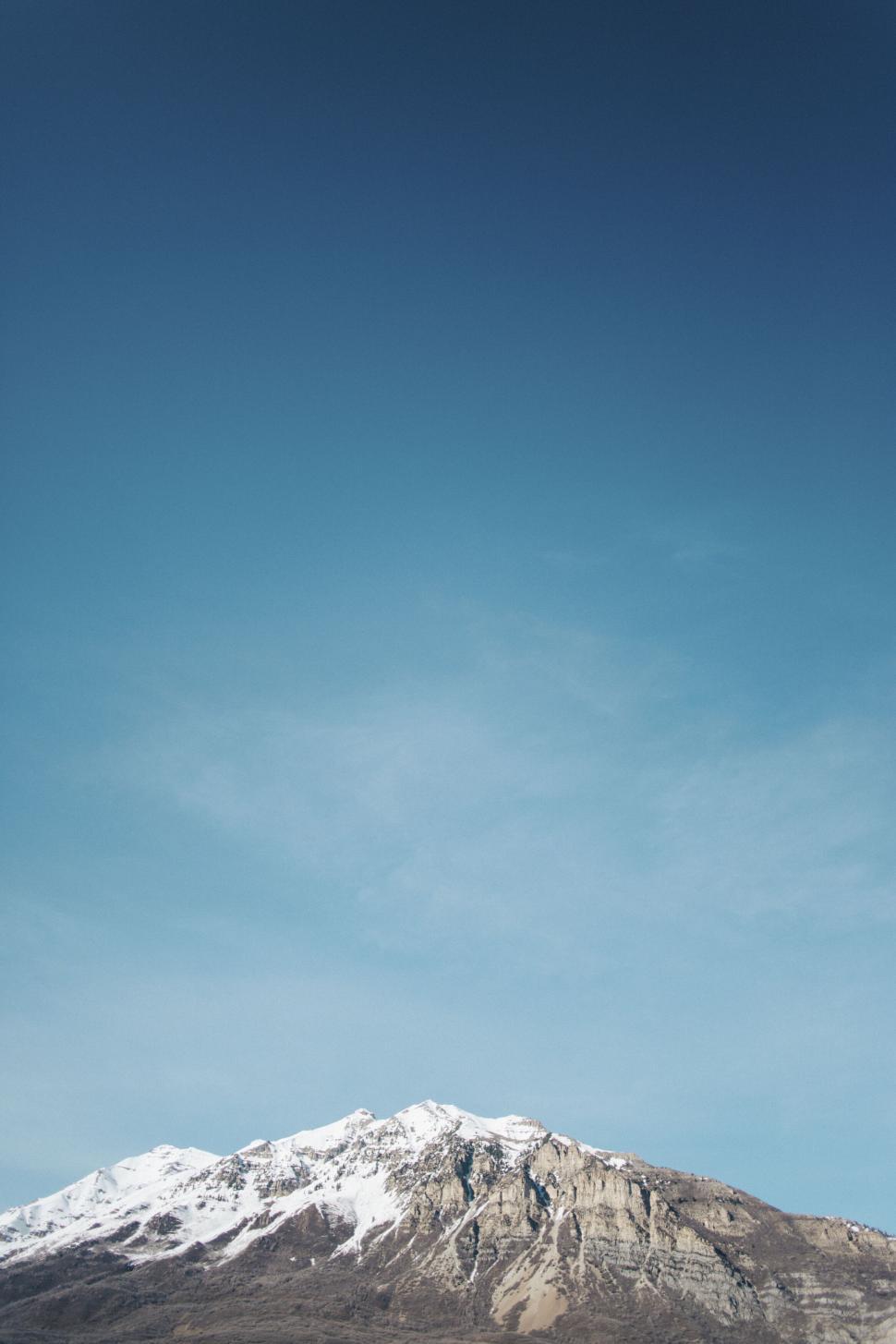 Free Image of Majestic snow-capped mountain under blue sky 