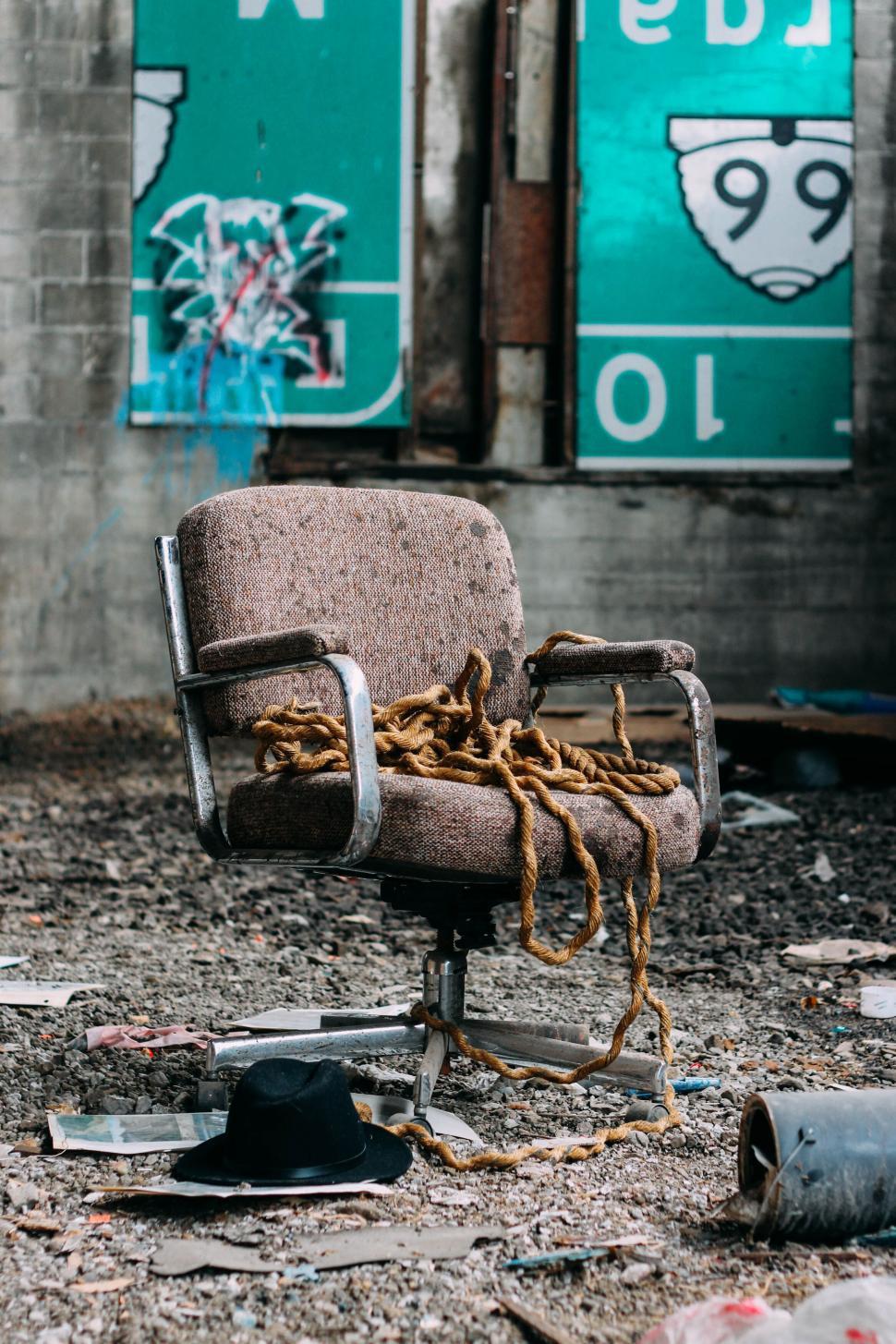 Free Image of Abandoned decaying chair in an urban setting 