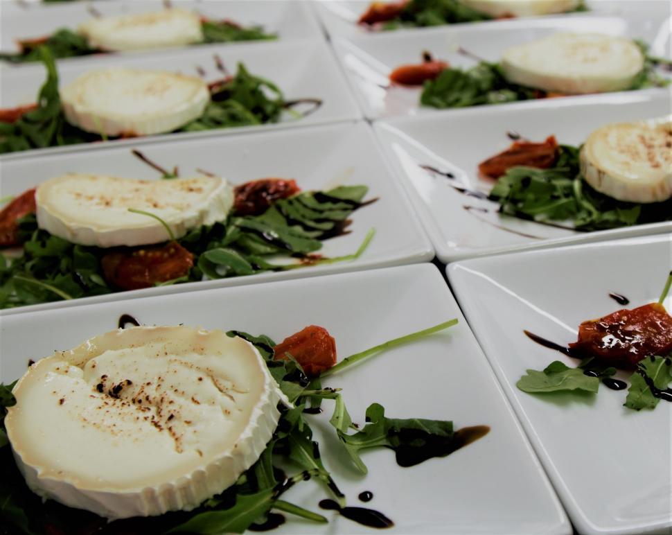 Free Image of Elegant goat cheese salad on white plates 