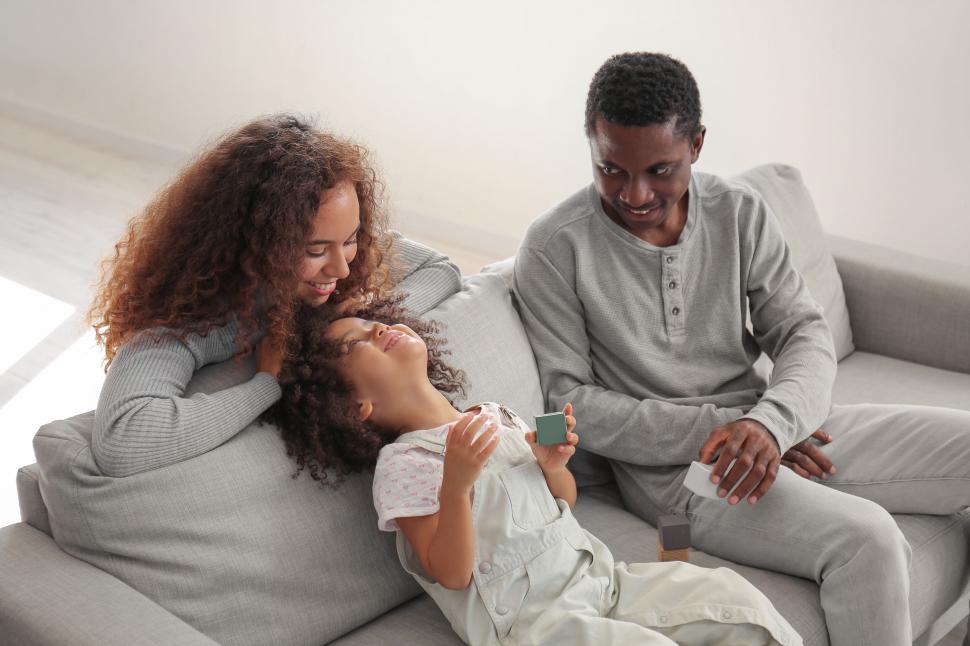 Free Image of Family enjoying time together on sofa 