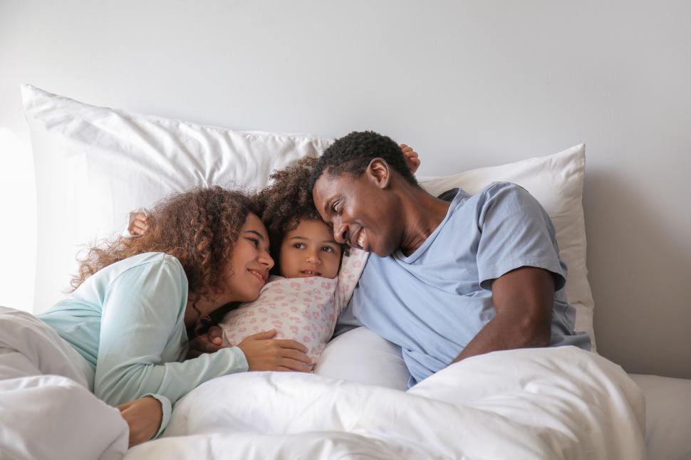 Free Image of Family bonding in cozy bedroom 