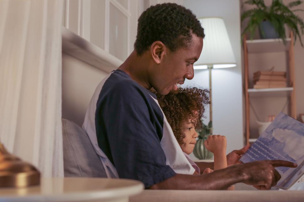 Free Image of Father and child reading together at home 