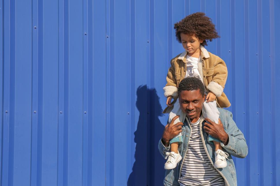 Free Image of Father giving daughter piggyback ride 