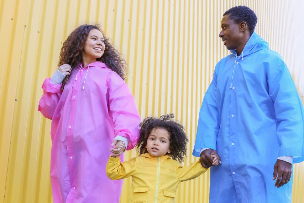 Free Image of Three people holding hands and walking 