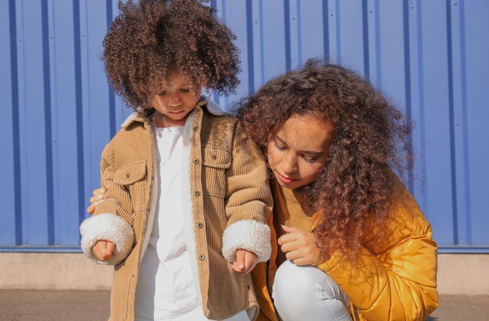 Free Image of Focused mother and daughter outdoors 