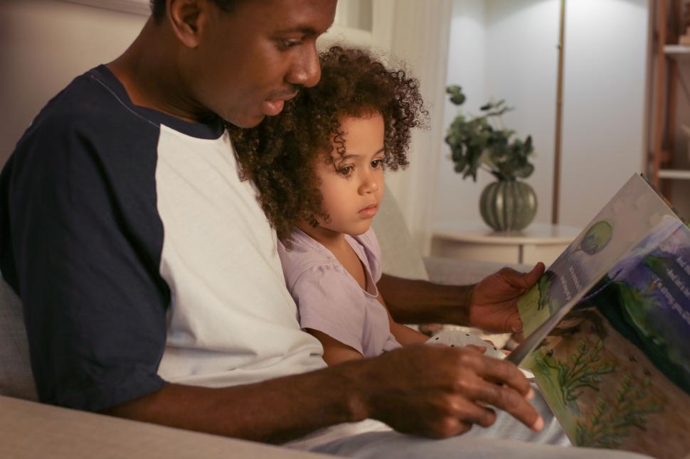 Free Image of Reading time with father and child 
