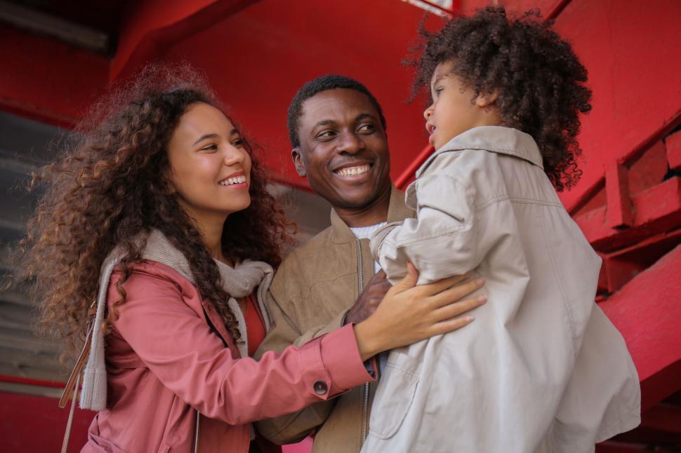 Free Image of Family interaction by red metal background 