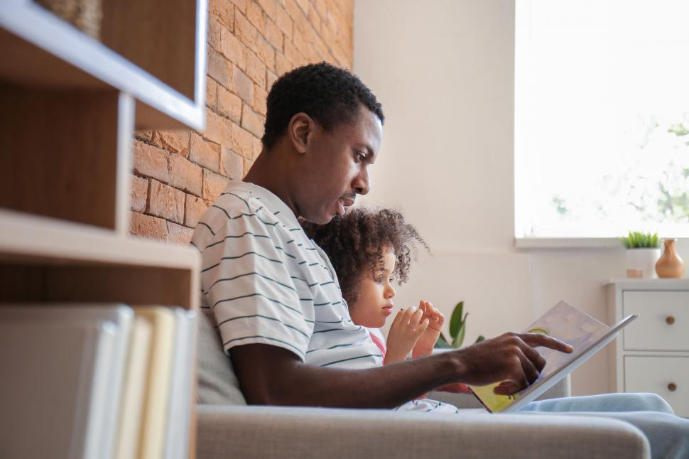 Free Image of Father and child reading together 