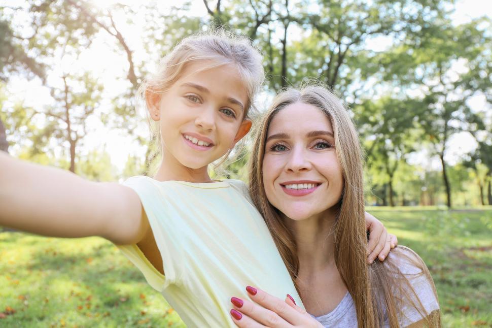 Free Image of Mother and daughter selfie with a happy smile 