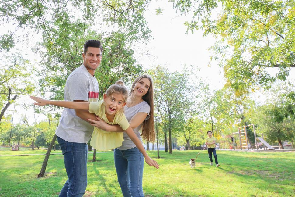 Free Image of Family playing with child outdoors 