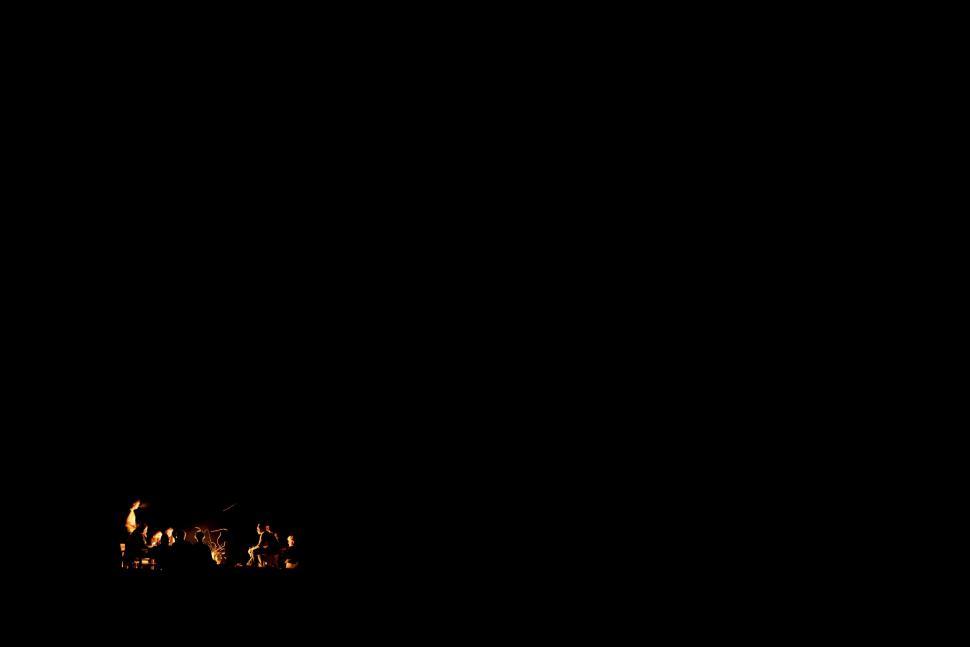 Free Image of Flames drawing a trail on a dark background 