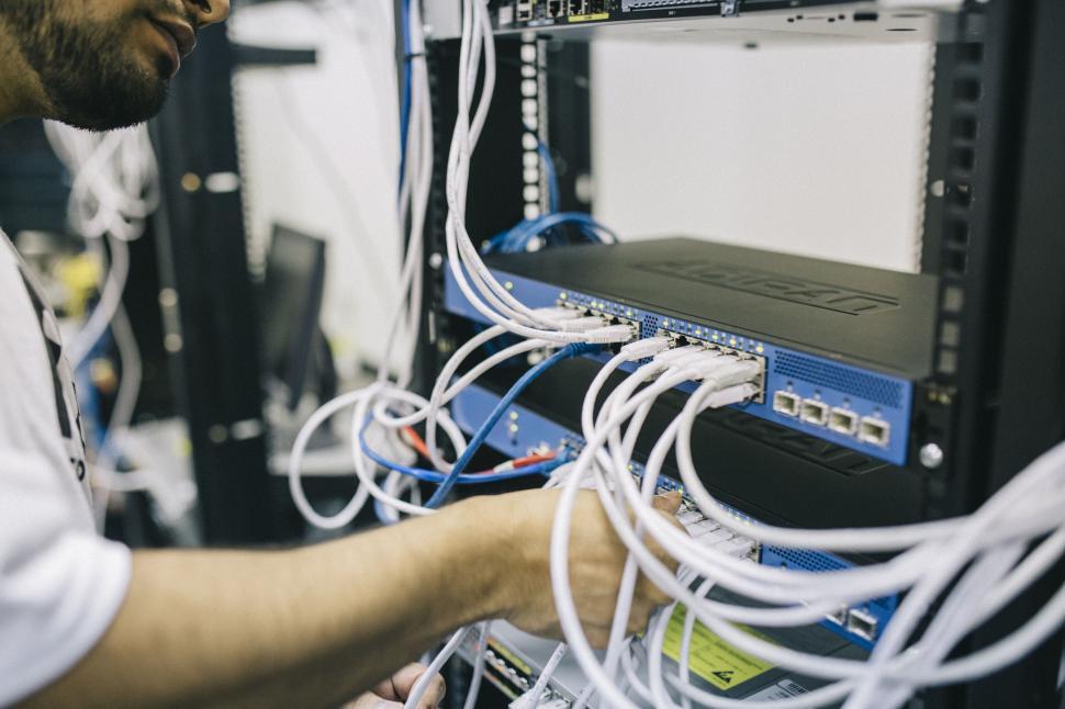 Free Image of Technician working on network server equipment 
