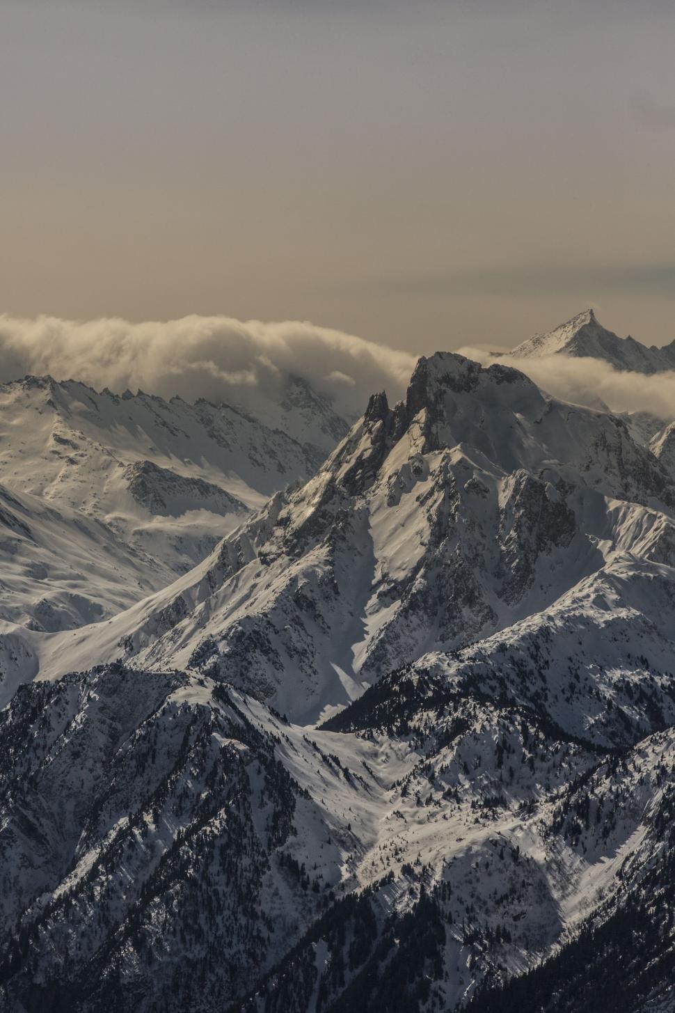 Free Image of Snow-capped mountain peaks at sunset 