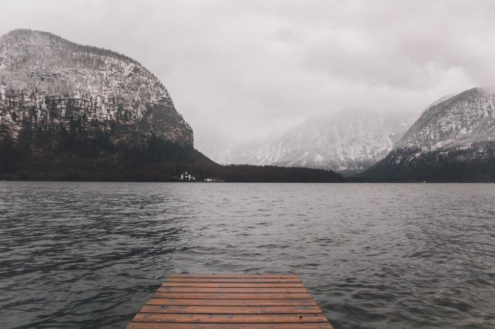Free Image of Wooden jetty leading to a misty lake 