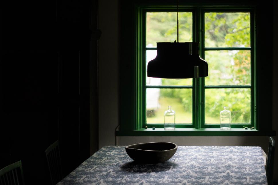 Free Image of Silhouette of a bowl on dining table 