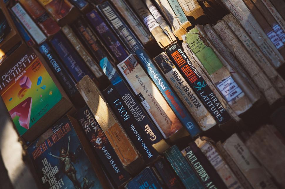 Free Image of Stack of various books in natural light 