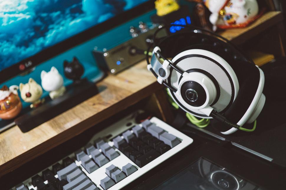 Free Image of Gaming accessories on a desk with blue lights 