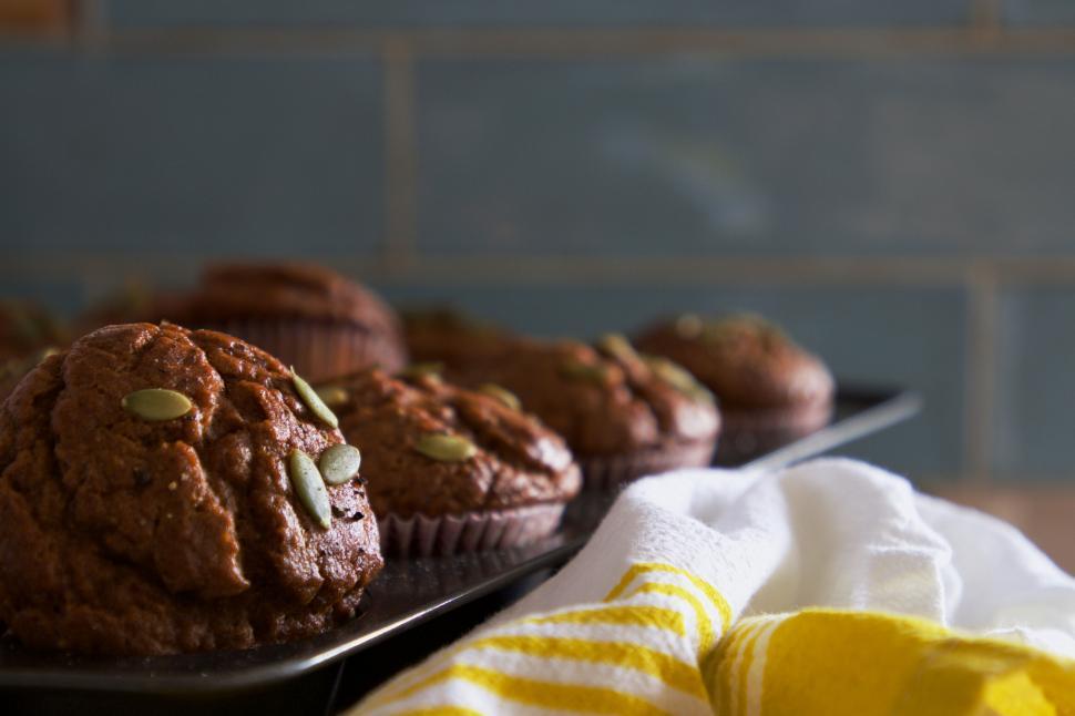 Free Image of Pumpkin muffins on tray with yellow napkin 