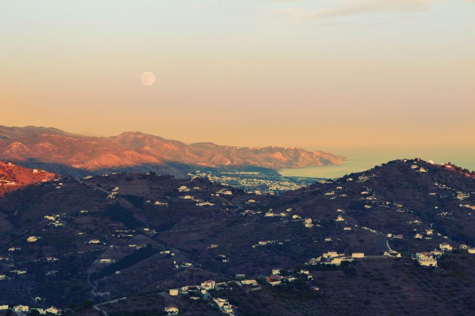 Free Image of Moonrise over tranquil coastal landscape 