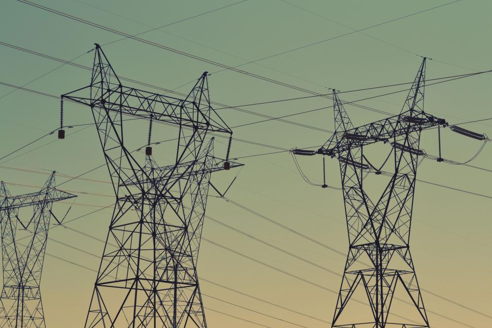 Free Image of Power lines silhouetted against twilight sky 
