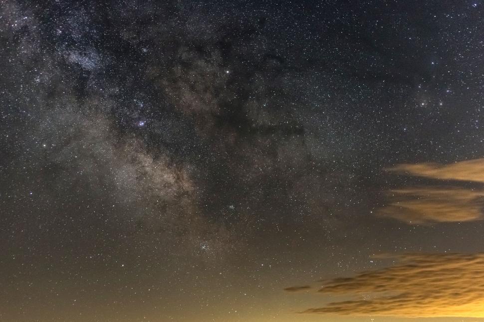 Free Image of Cosmic cloudscape over moody night horizon 