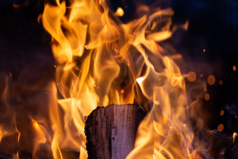 Free Image of Blazing campfire with intense orange flames 