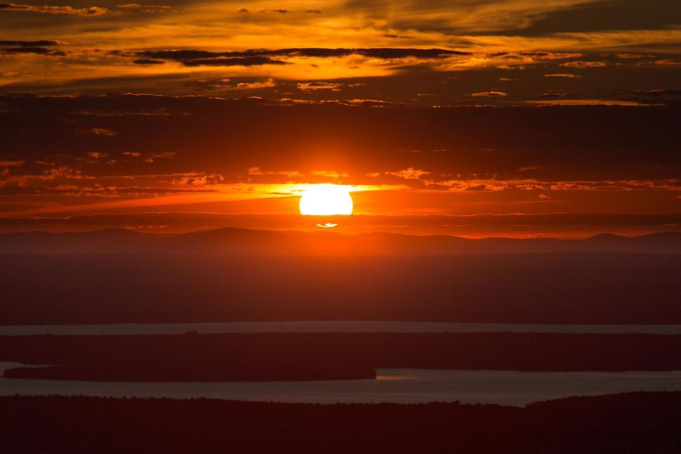 Free Image of Sunset Over a Mountainous Landscape 