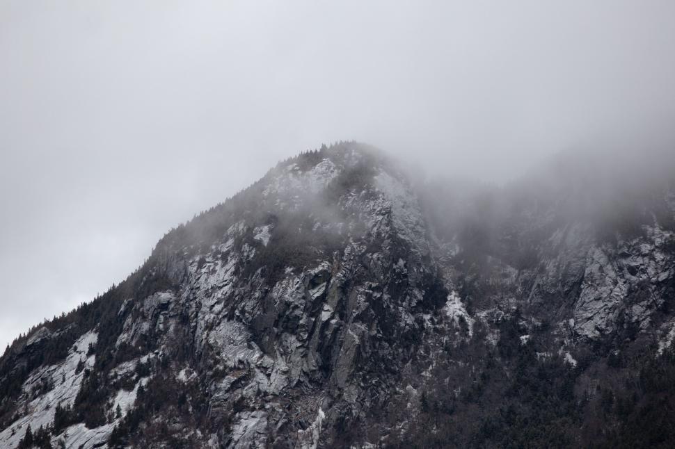 Free Image of Misty Mountain Peak in a Cloudy Sky 