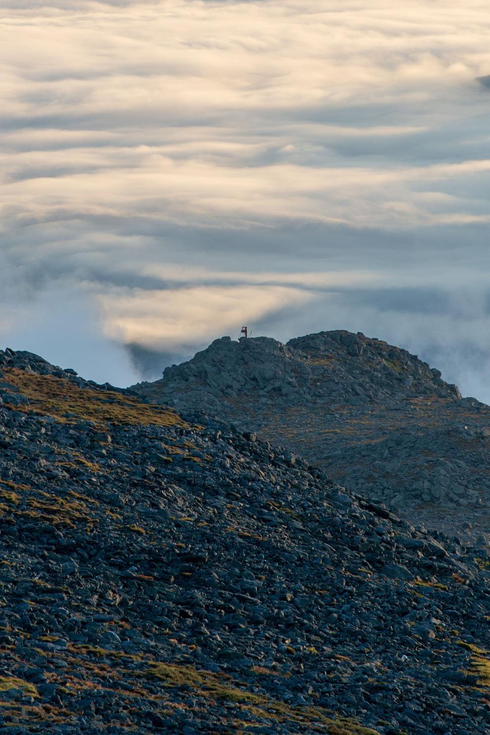 Free Image of Lone figure on a mountain at dusk 
