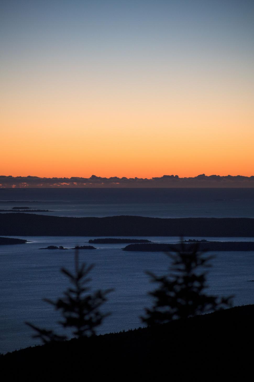 Free Image of Sunset over serene water and islands 