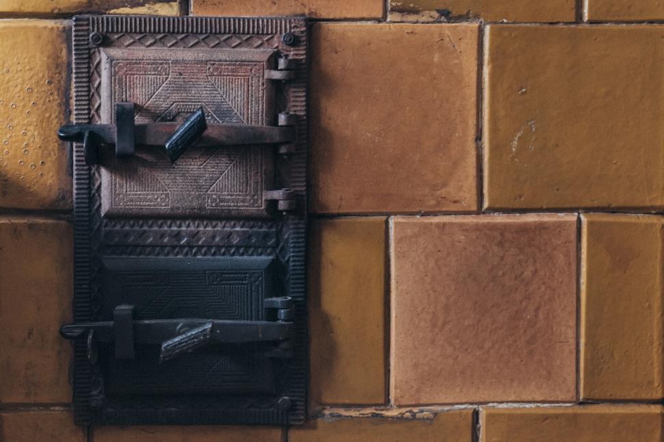 Free Image of Vintage lock on yellow terracotta tile wall 