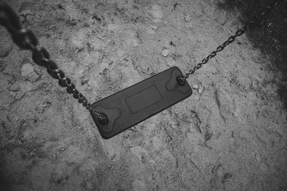 Free Image of Empty swing in black and white tones 