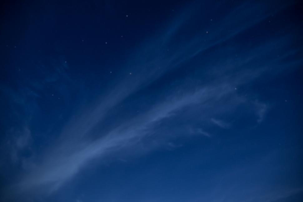 Free Image of Night sky with wispy clouds and stars 