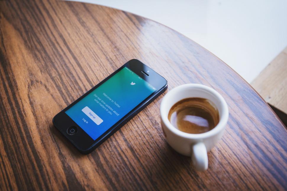Free Image of Smartphone on table with Twitter app open 