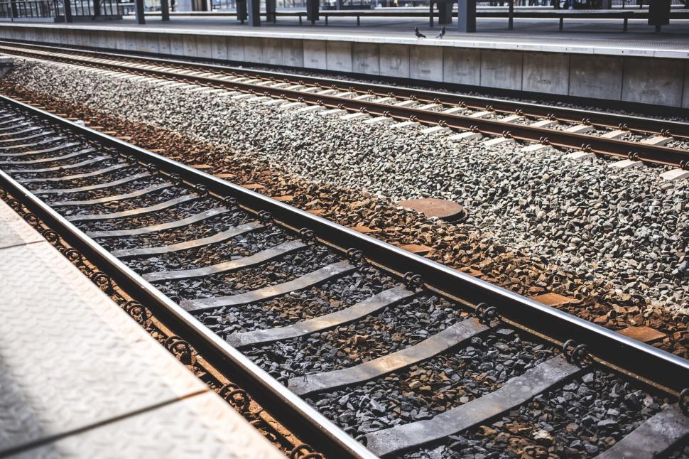 Free Image of Railway tracks with urban backdrop 