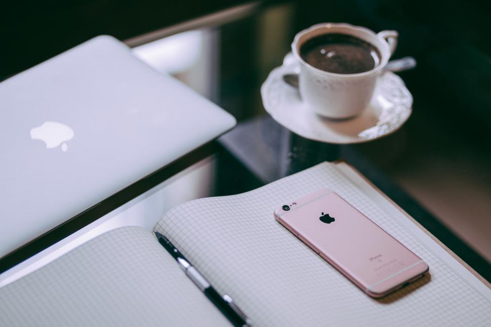 Free Image of Laptop and coffee cup on a glass table 