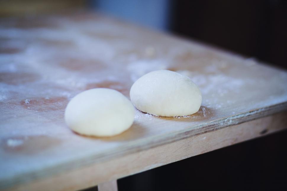 Free Image of Fresh dough on wooden table for baking bread 