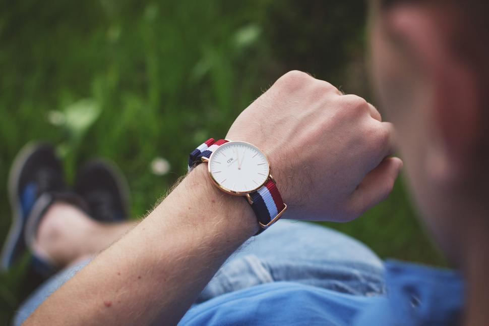 Free Image of Man checking time on a stylish wristwatch 